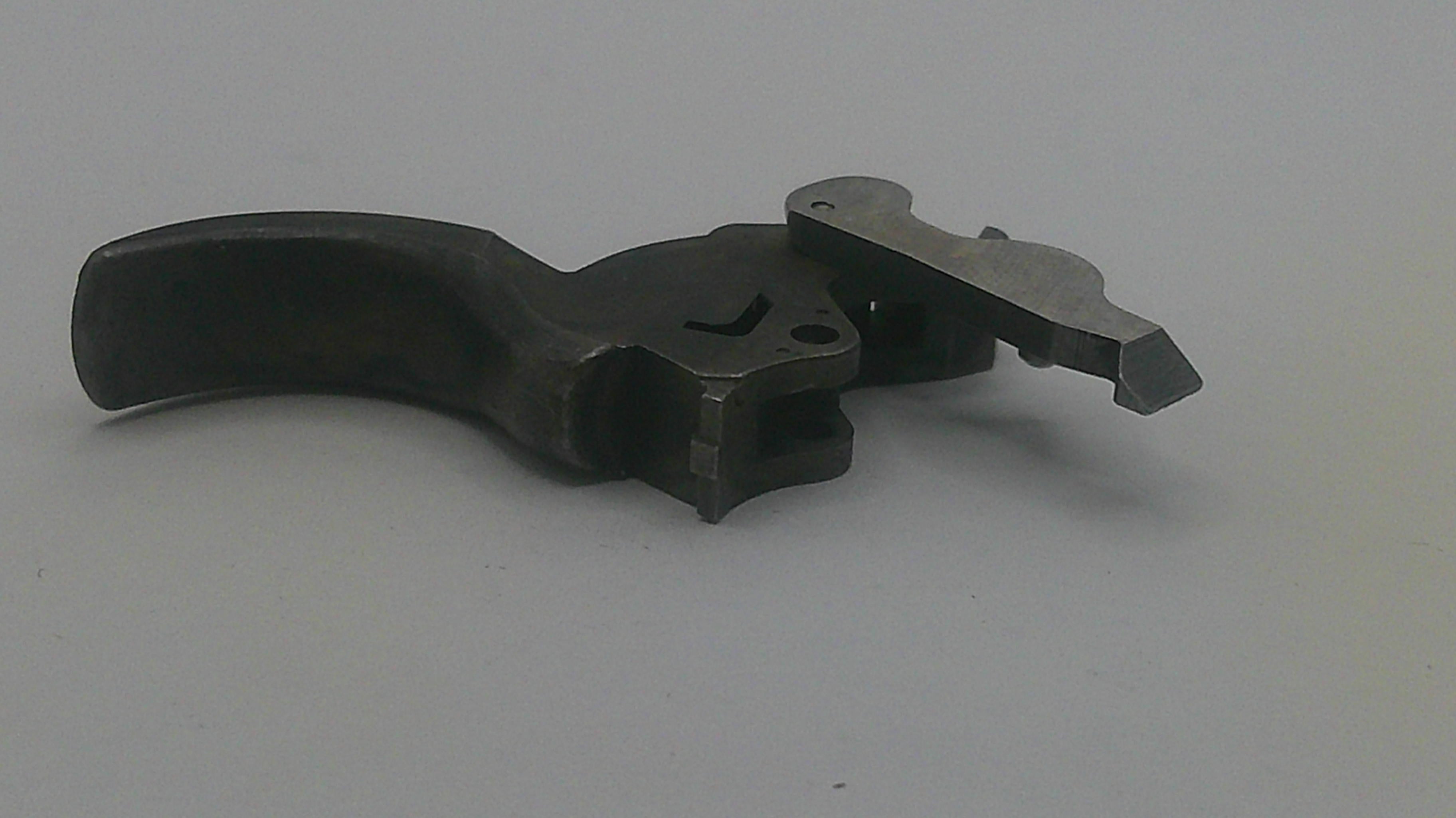 Metal tool or component on a gray background