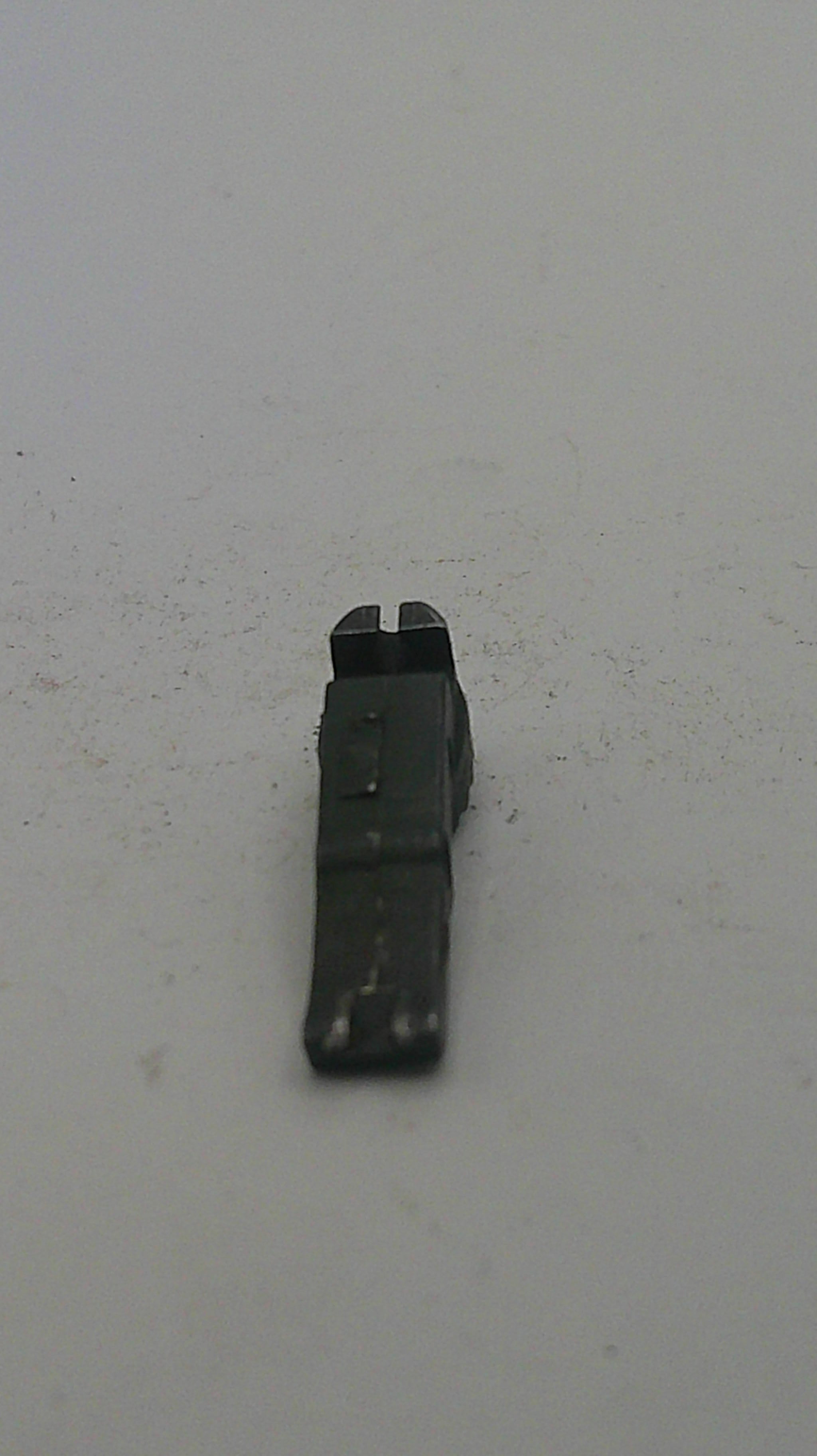 Black metal bracket on a light gray background