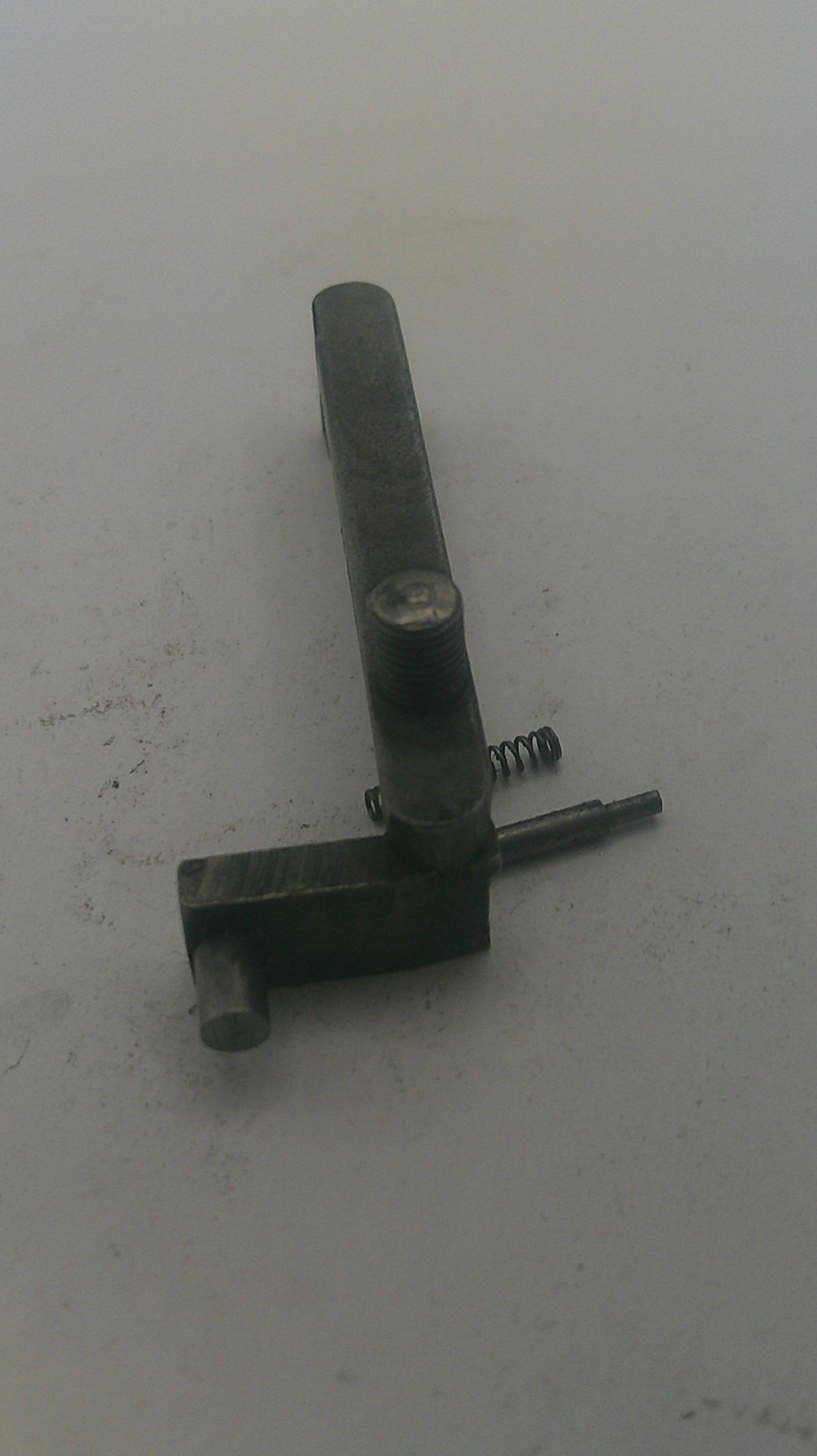 Metal lever with a screw on a white background