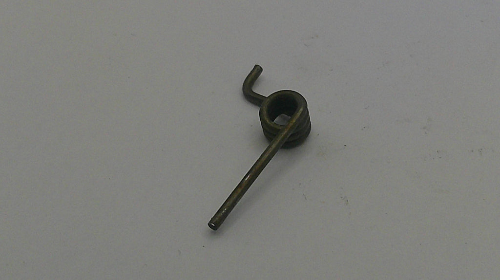 Small metallic object on a light gray background