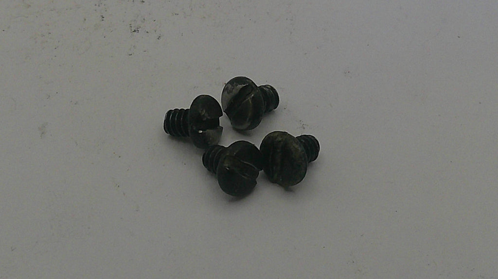 Small black screws on a light gray background