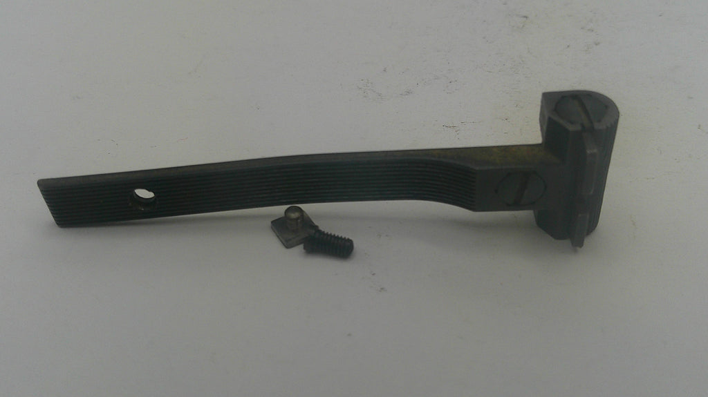 A black metal door hinge bracket with a small matching screw, shown on a plain off-white background.