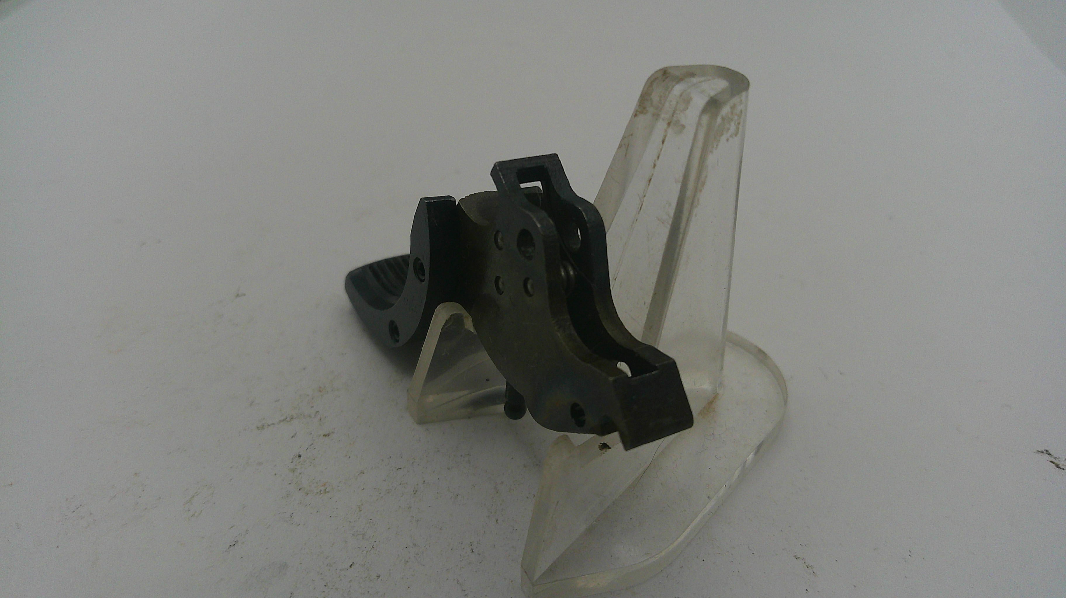Clear plastic stand with black metal bracket on a white background
