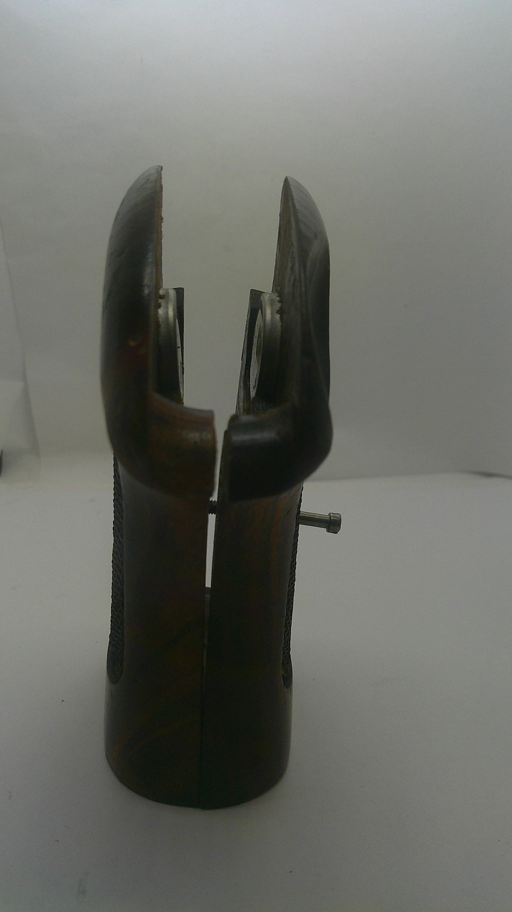 A dark brown wooden hand saw with a polished finish, shown horizontally against a plain white background.