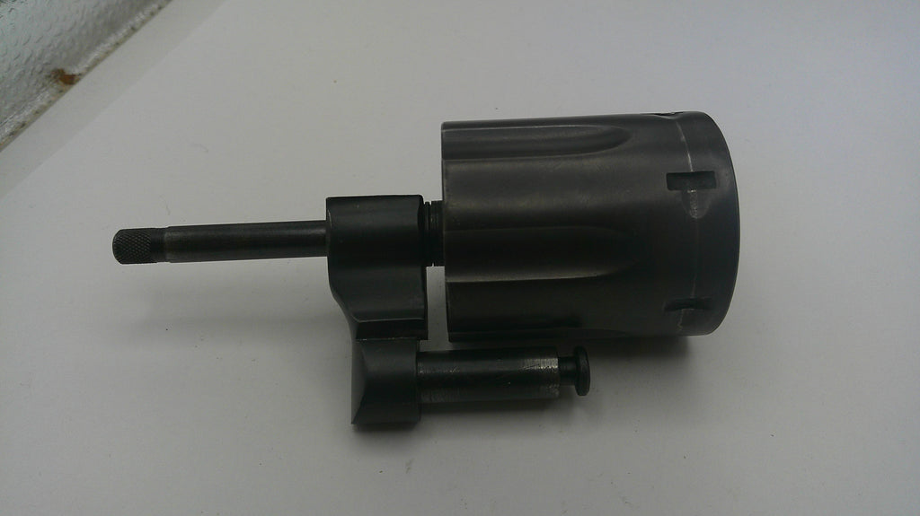 Black mechanical component on a white surface