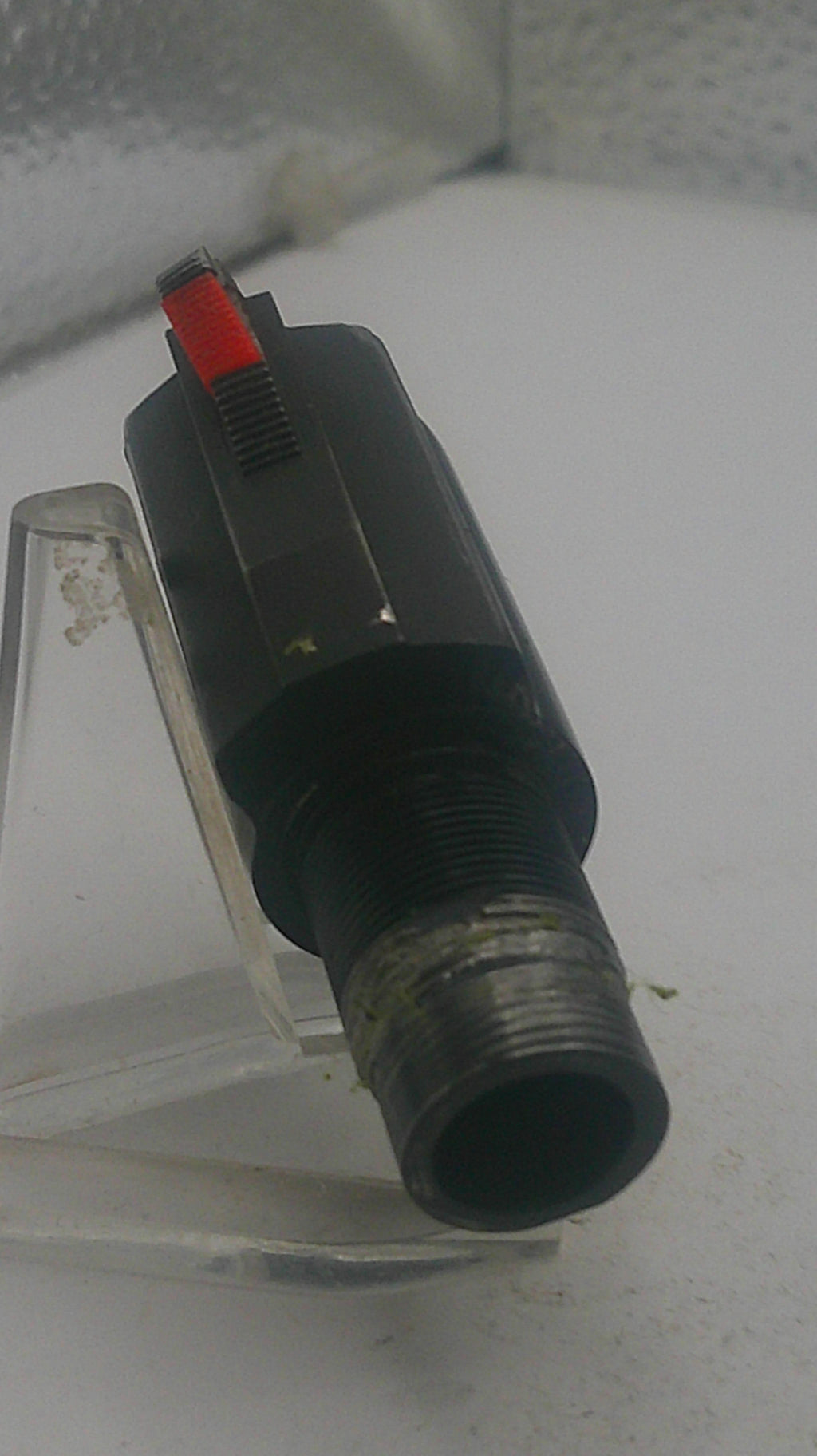 Black and red valve on a white background