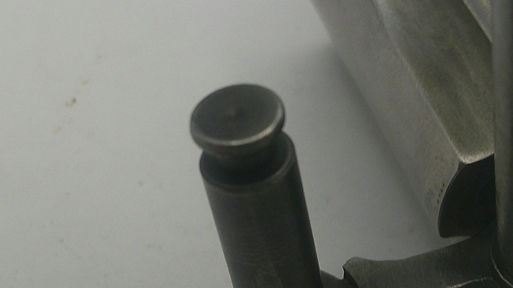 Close-up of a metal component on a white background