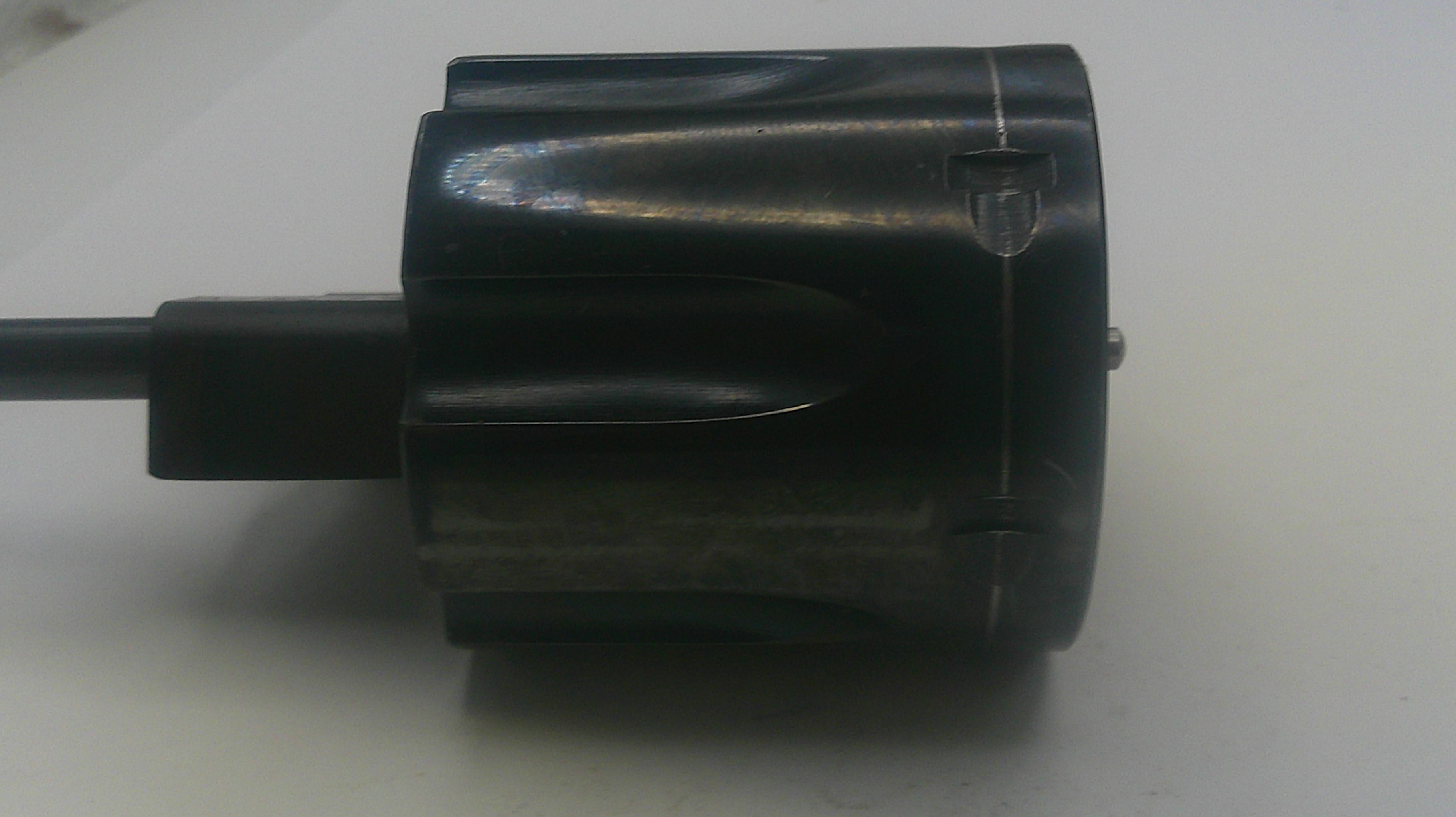 Black cylindrical object with a cable on a white background