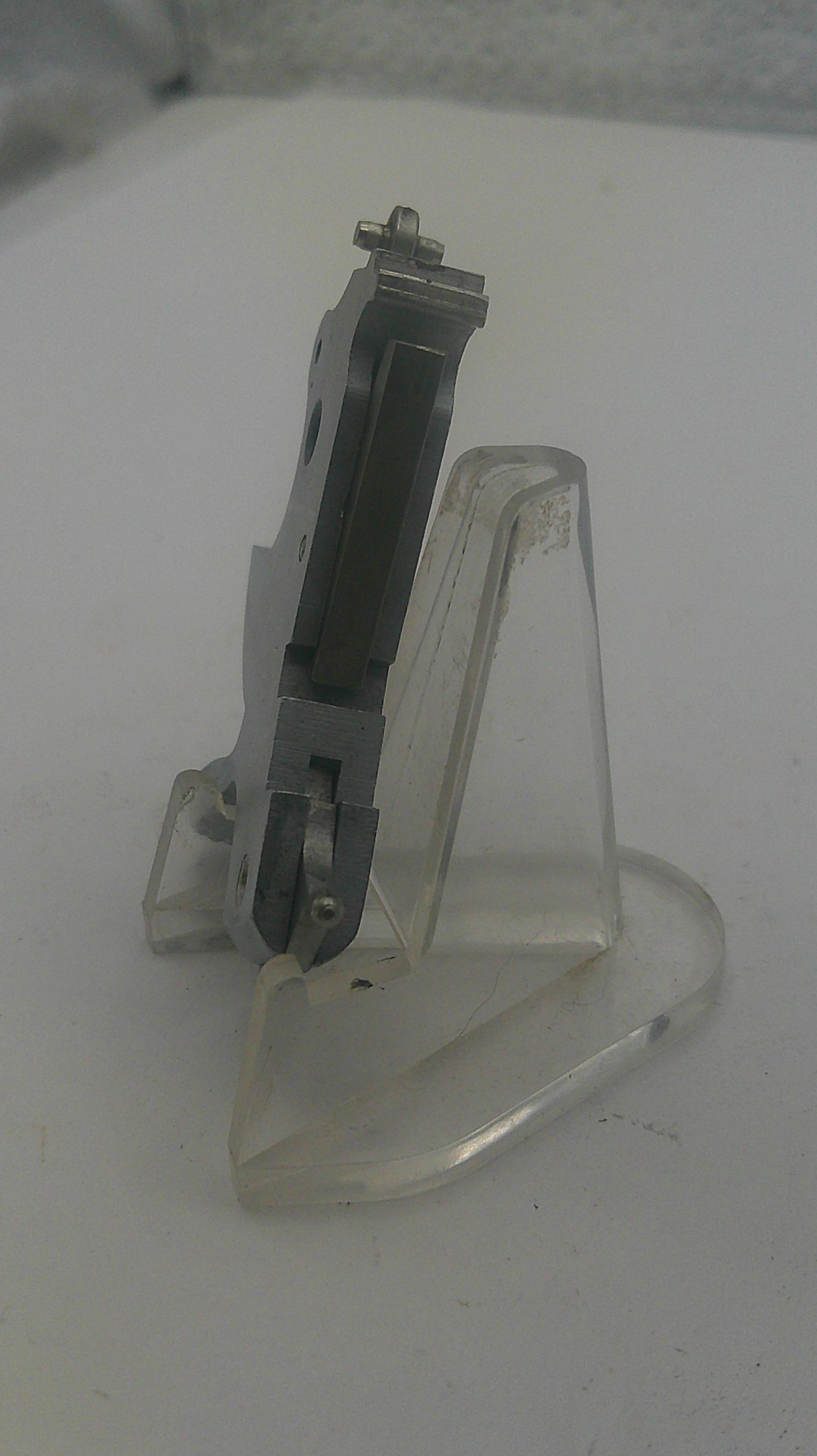 Clear plastic bracket on a white background