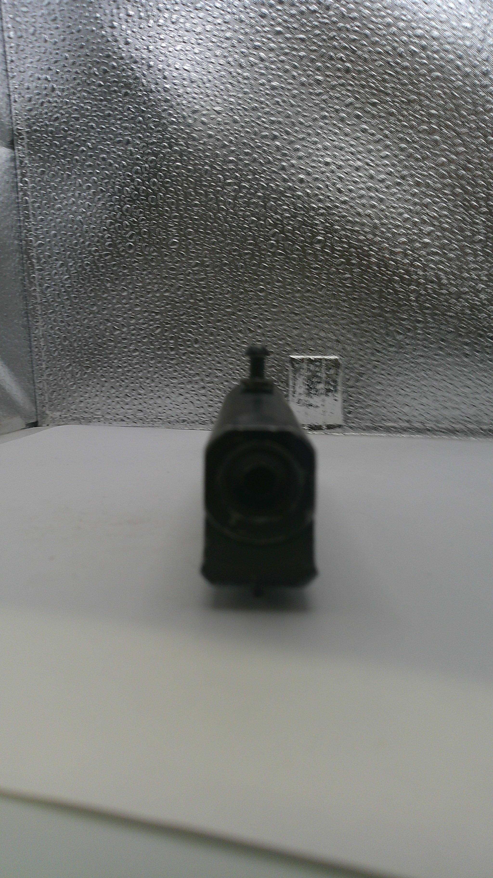 Black electrical plug on a textured gray surface