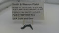 Smith & Wesson pistol firing pin safety lever with label on a white background