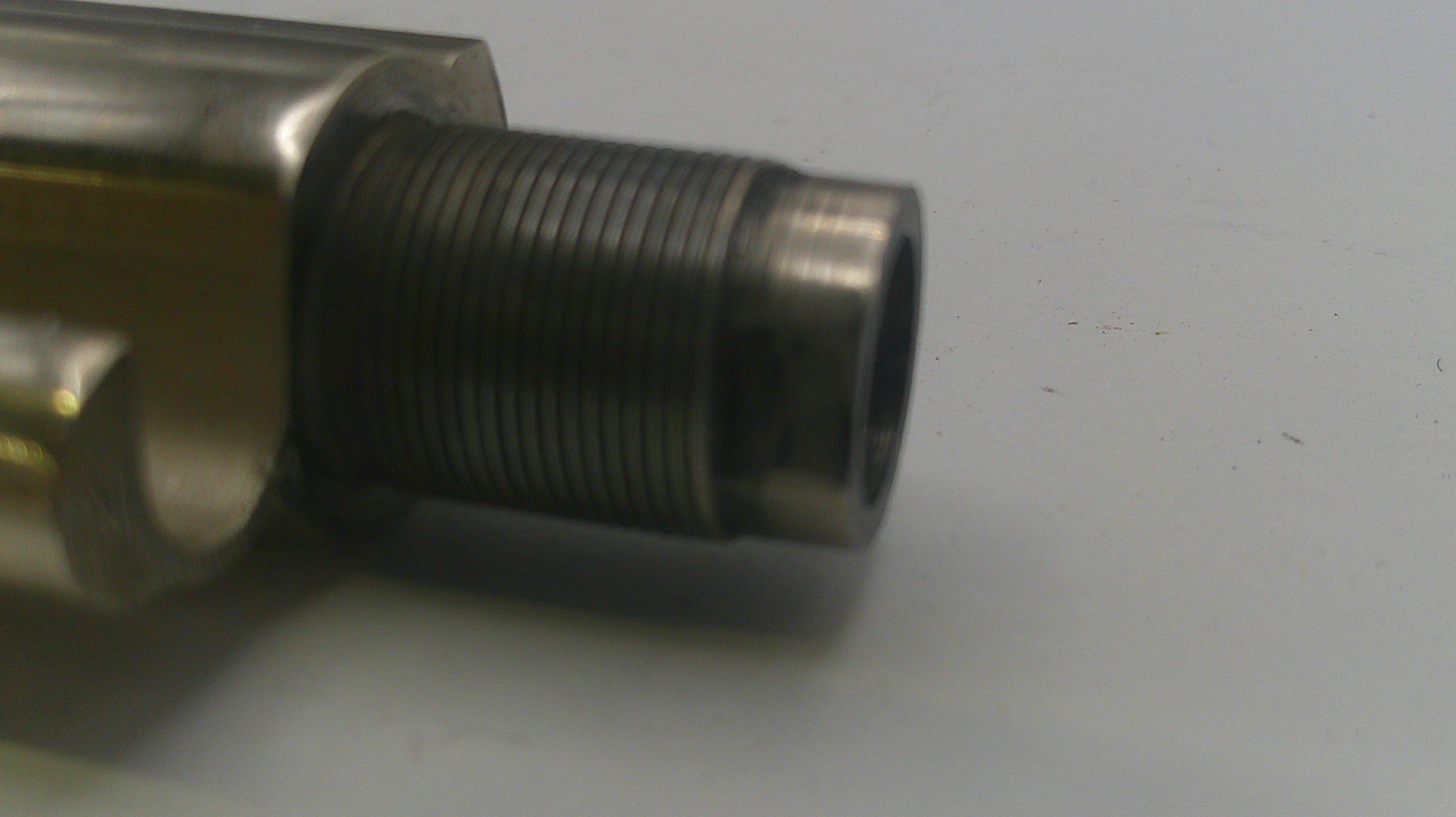 Metal mechanical component on a white background