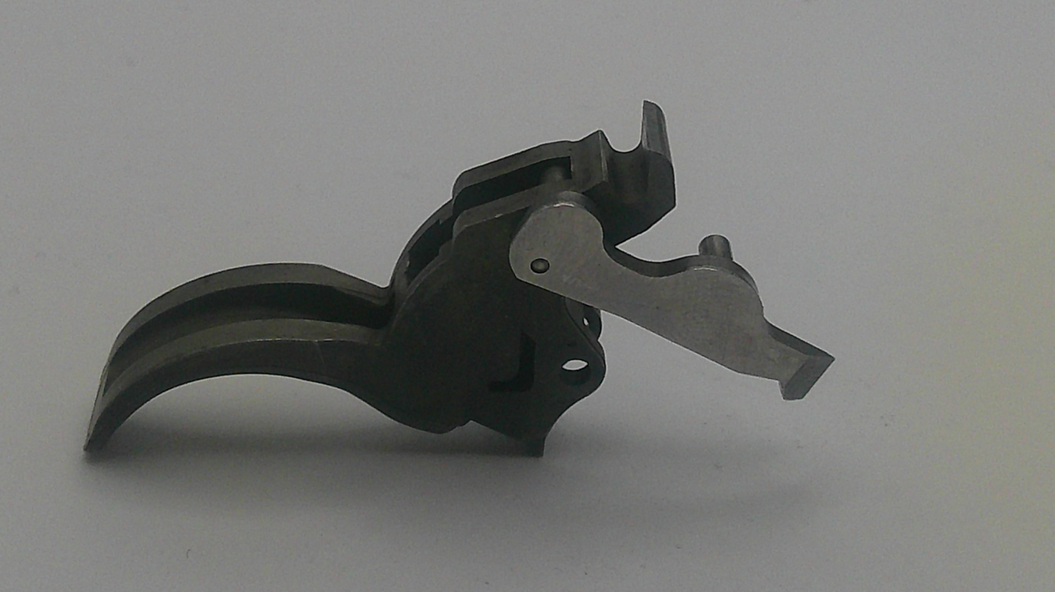 Metallic tool or component on a gray background