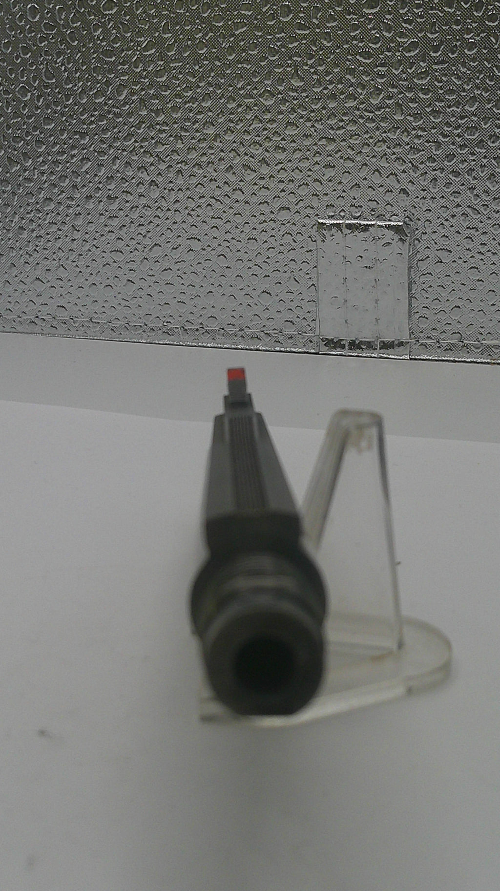 Black marker on a textured white surface