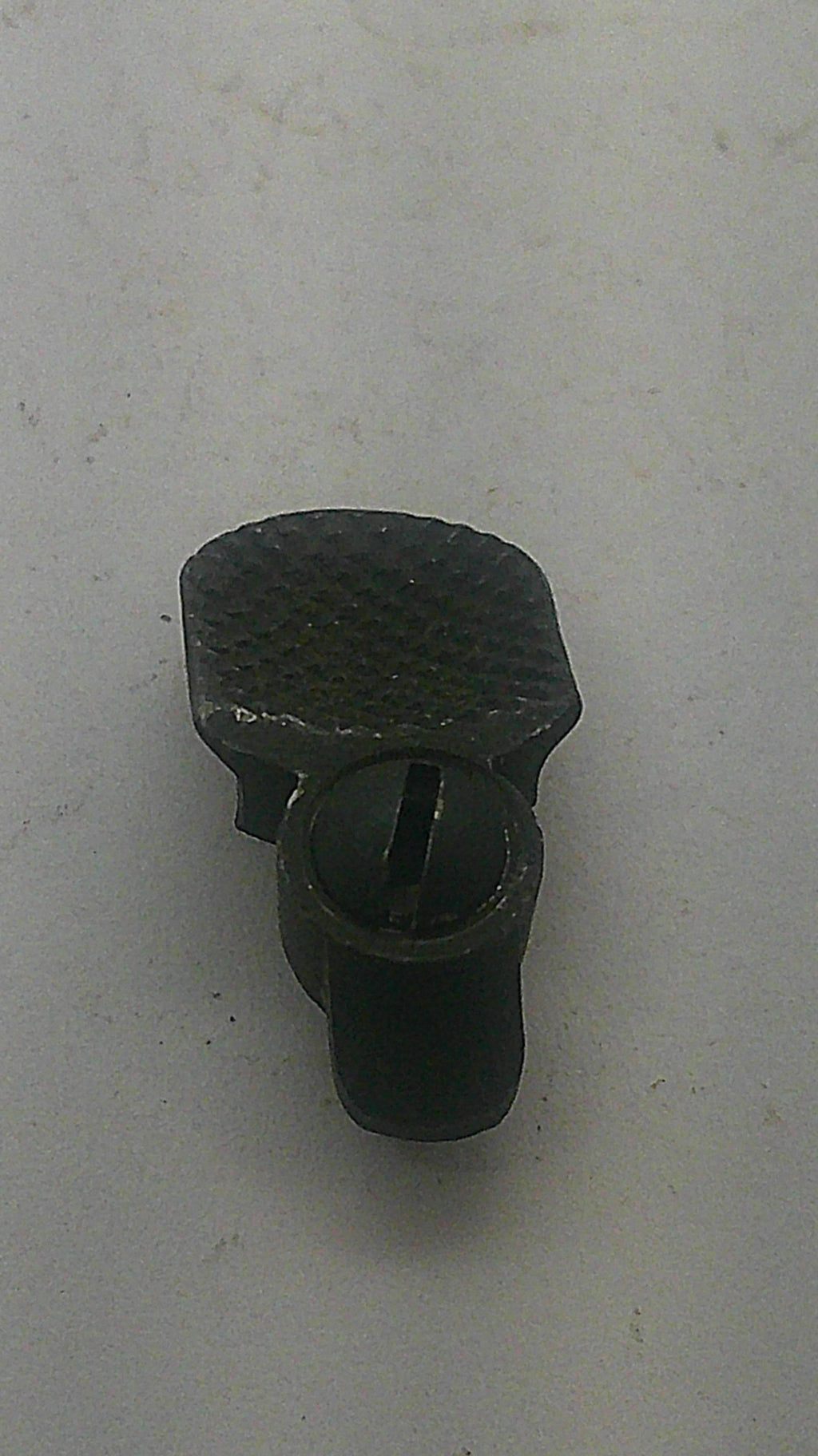 Smith & Wesson used blued thumb piece and nut, inventory reference K831, angled face view