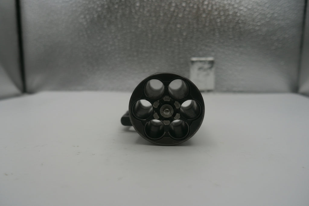 Black cylindrical object on a textured surface