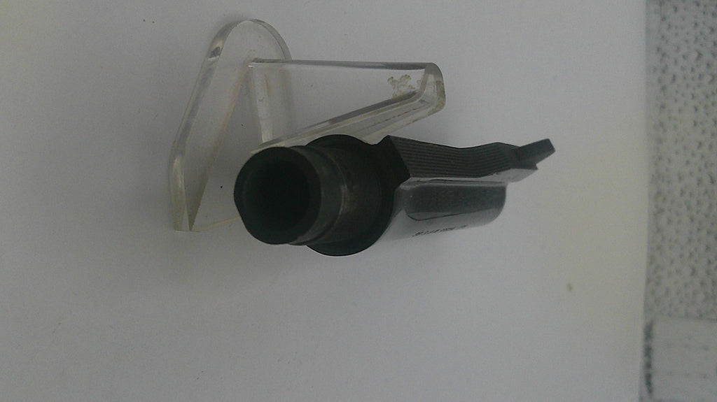 Black and clear plastic component on a white background