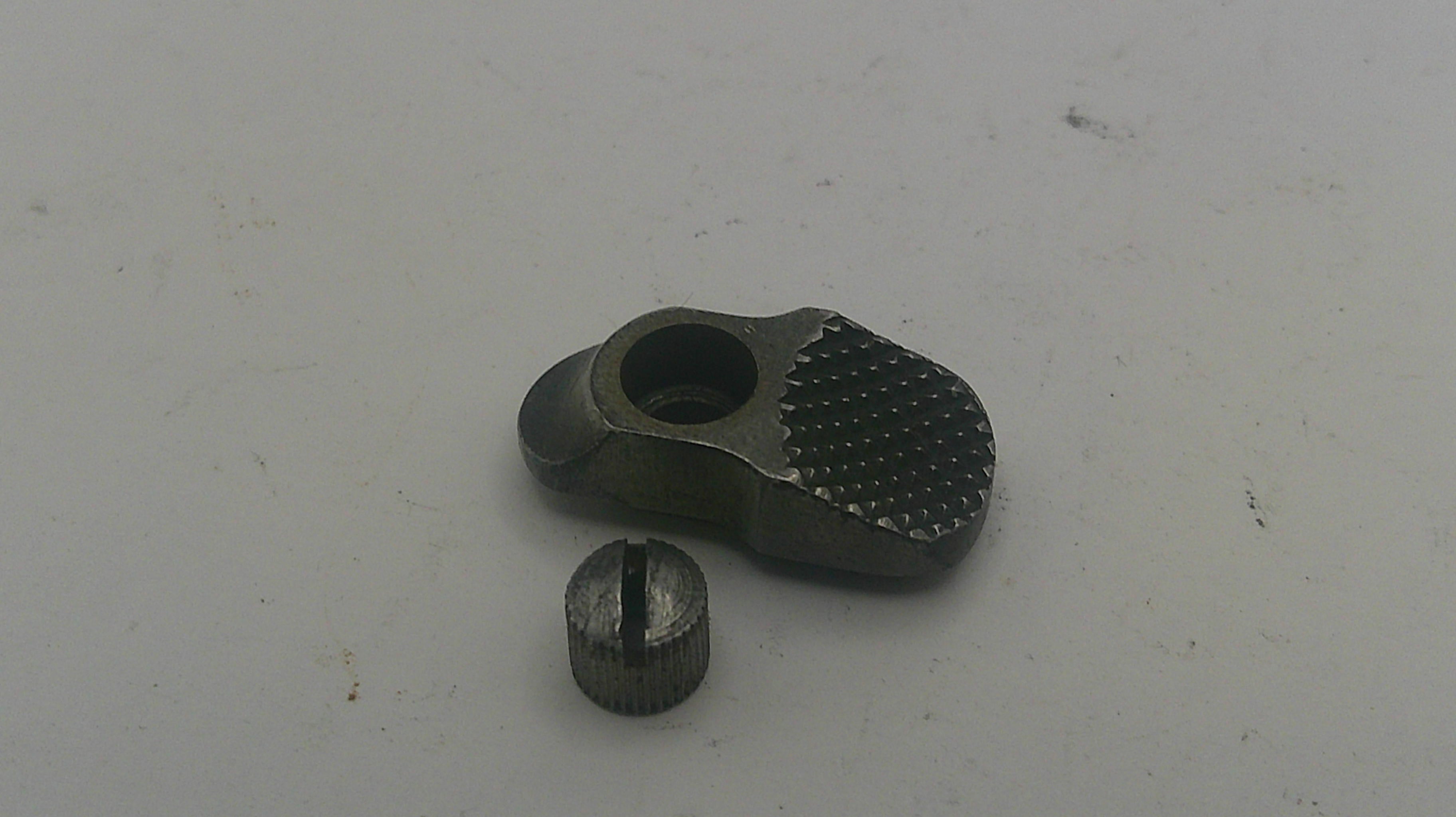 Two metallic objects on a light gray background