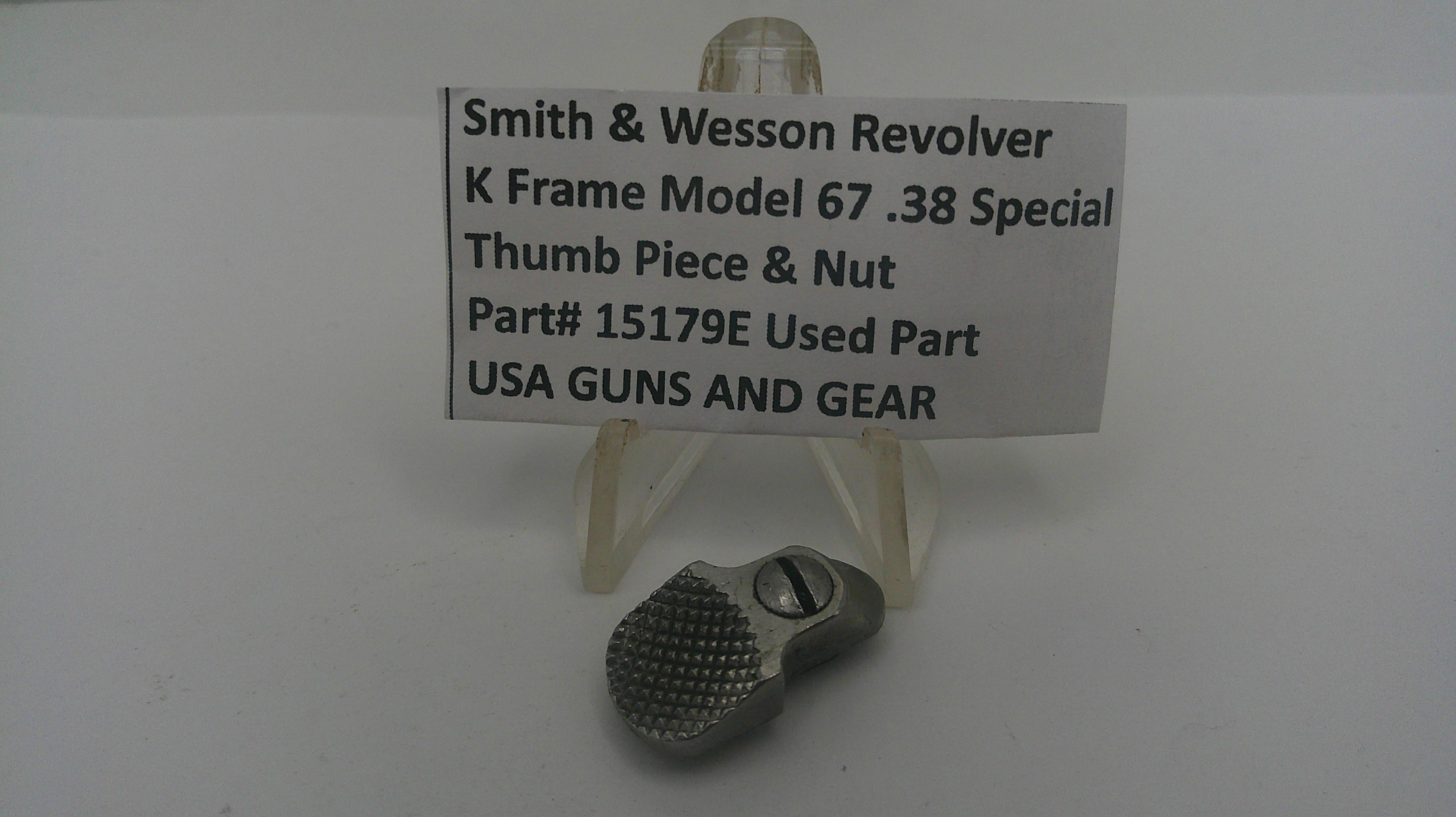 Smith & Wesson revolver thumb piece and nut on a stand with a label