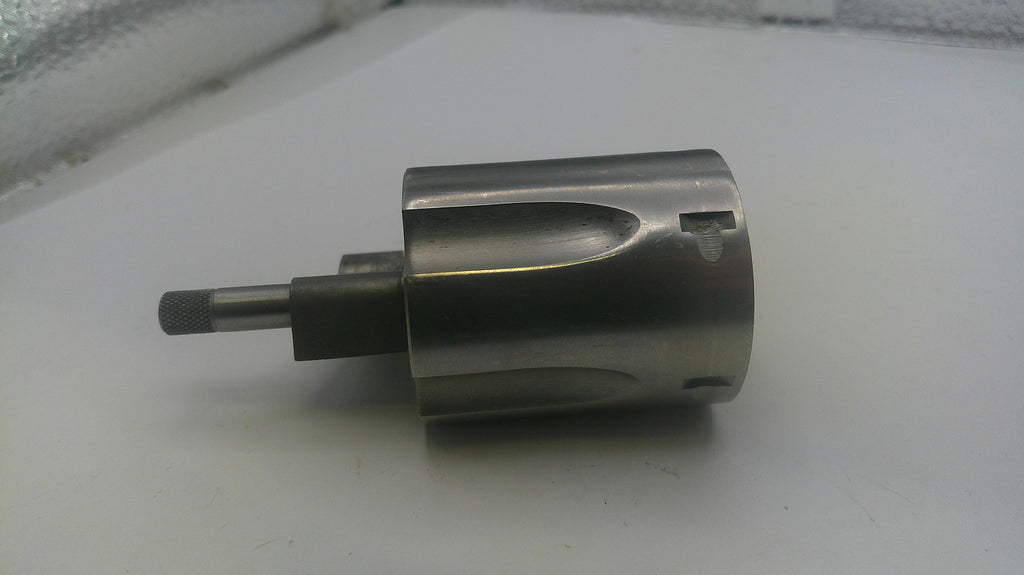 Metal cylindrical component on a white surface