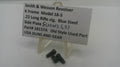 Smith & Wesson revolver screws on a white background with a label.