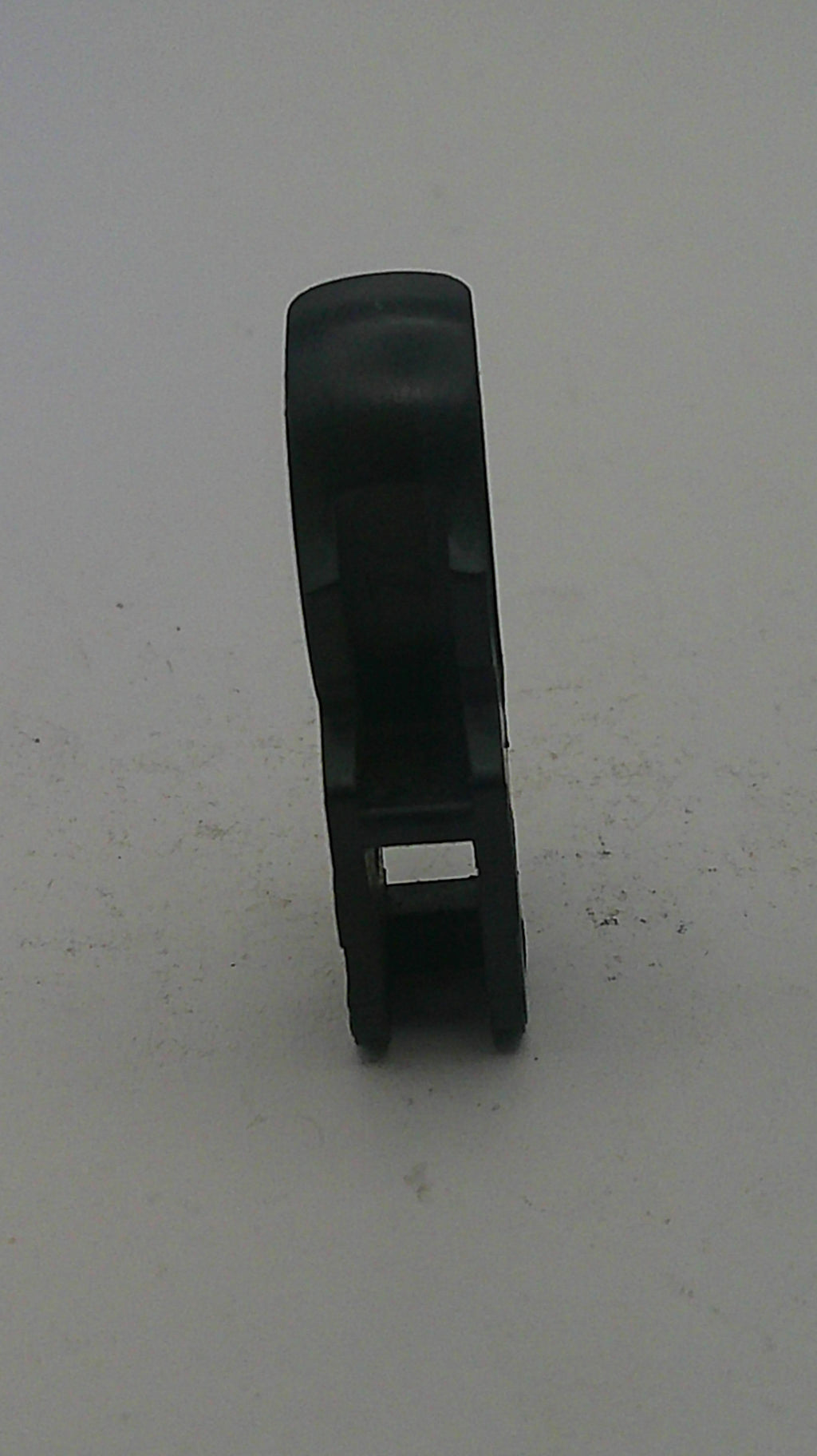 Black plastic clip on a light gray background