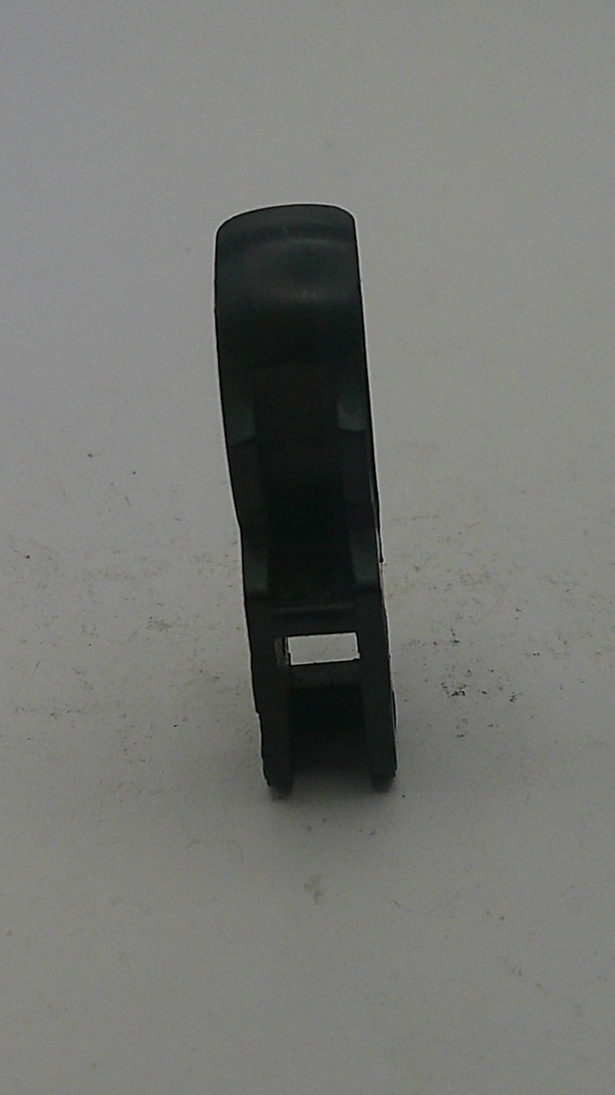 Black plastic clip on a light gray background