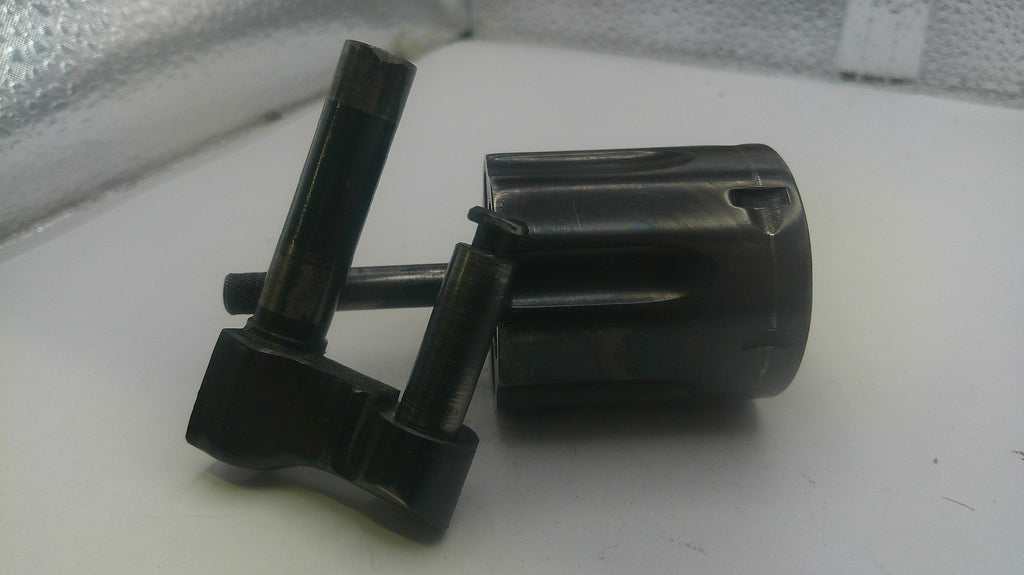Black mechanical components on a white surface