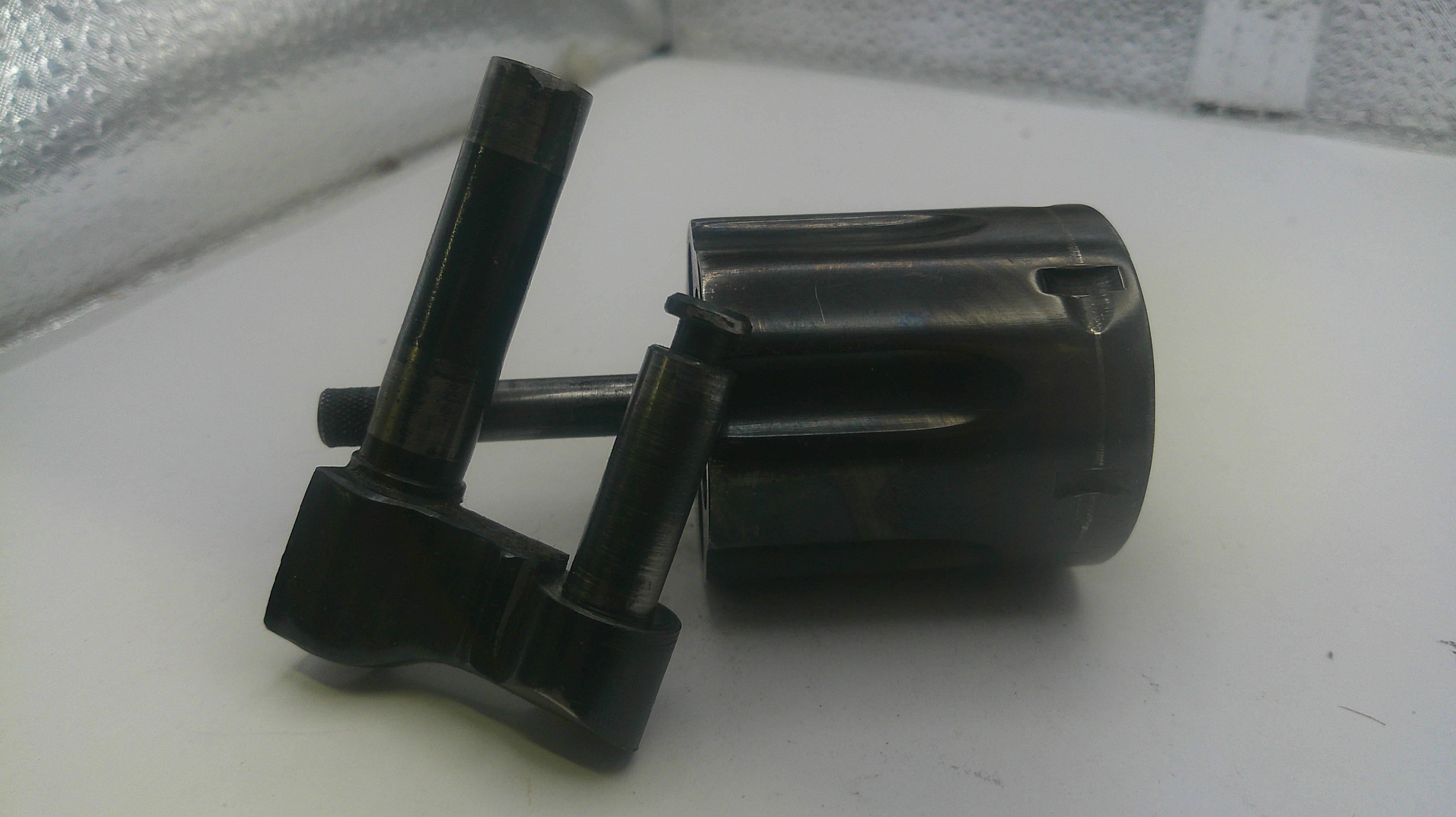 Black mechanical components on a white surface