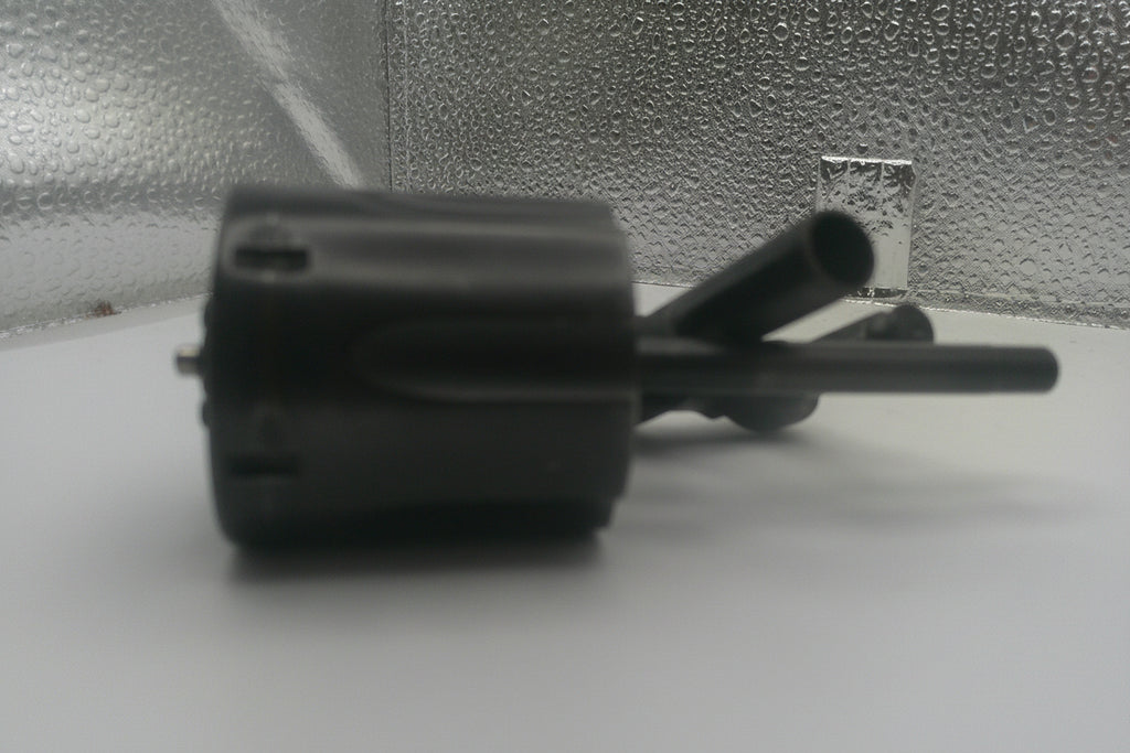 Black mechanical component on a reflective surface