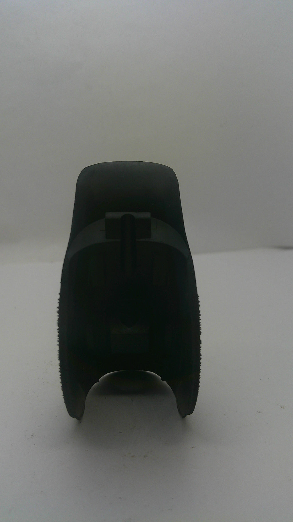 A black plastic replacement part, likely a filter element or cap, shown against a plain white background.