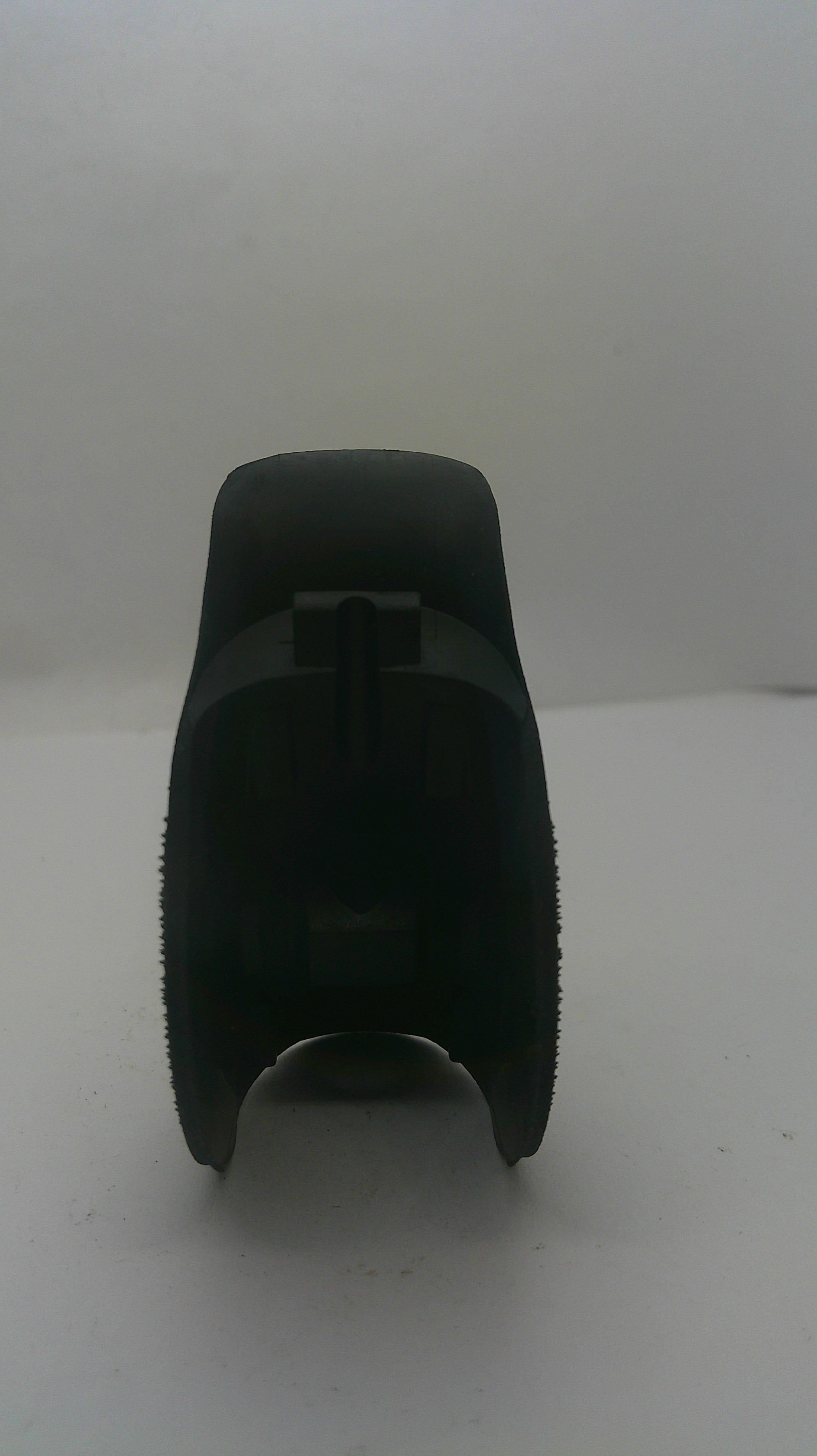 A black plastic replacement part, likely a filter element or cap, shown against a plain white background.