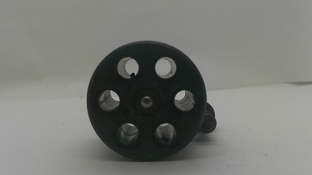 A black plastic six-hole suppressor or muzzle device with circular cutouts, shown on a plain light gray background.