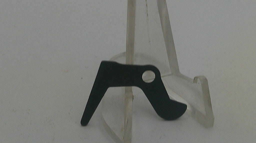 Black metal bracket on a clear stand against a white background