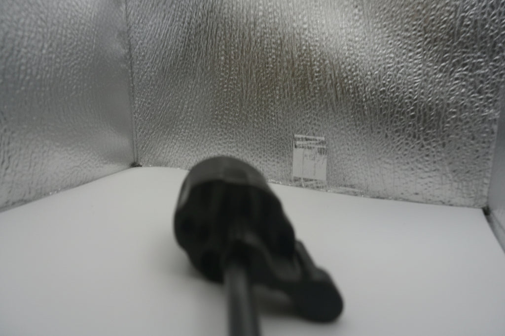 Close-up of a textured gray fabric surface with a small label.