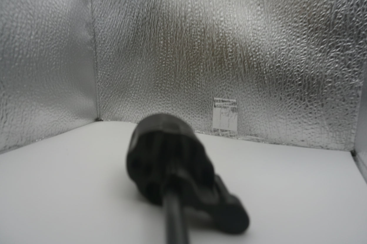 Close-up of a textured gray fabric surface with a small label.