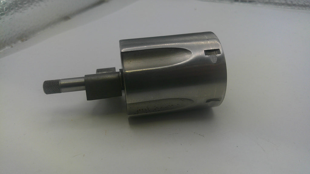 Metal drill bit on a white surface