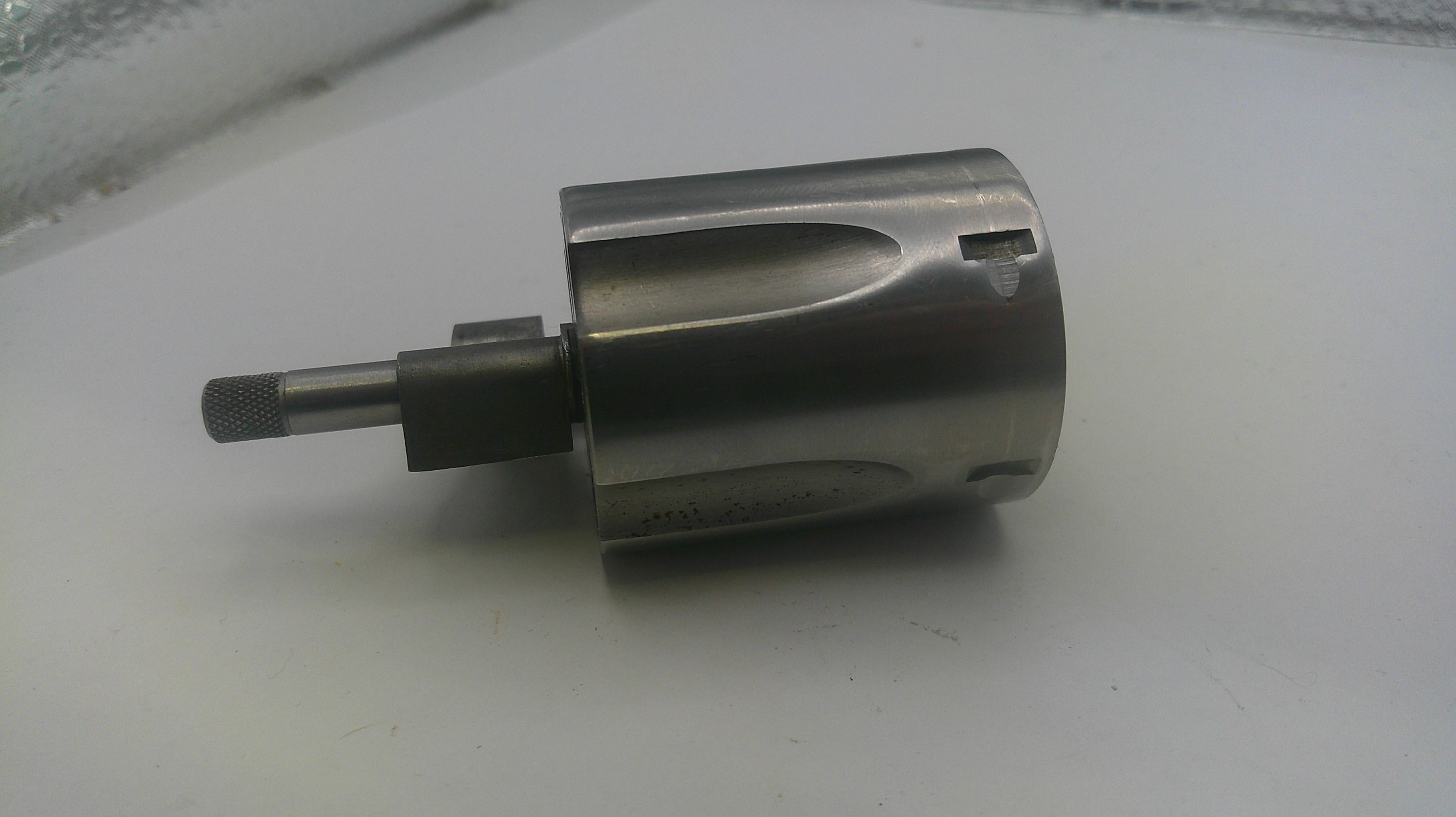 Metal drill bit on a white surface