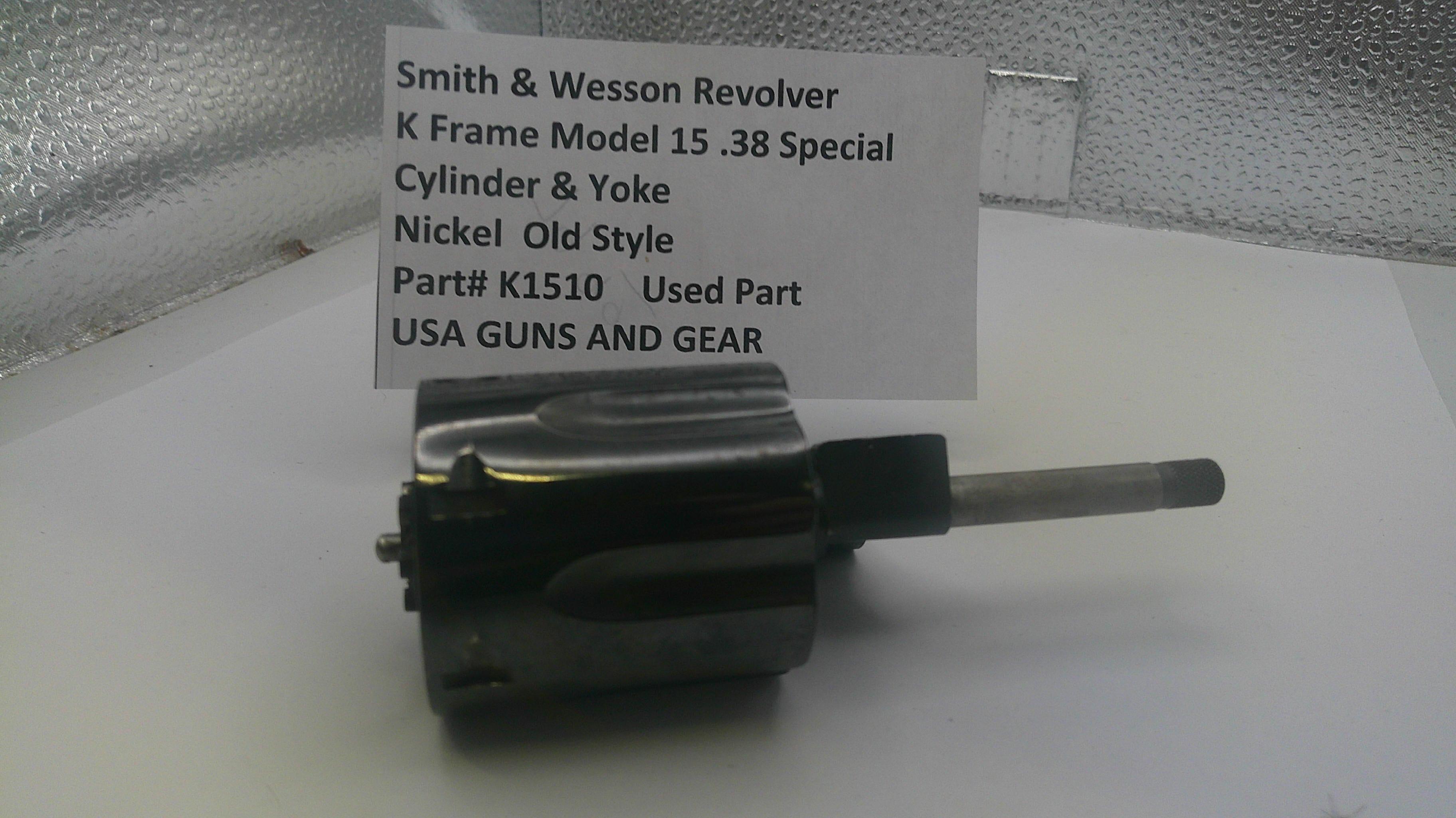 Smith & Wesson revolver part on a white surface with a label