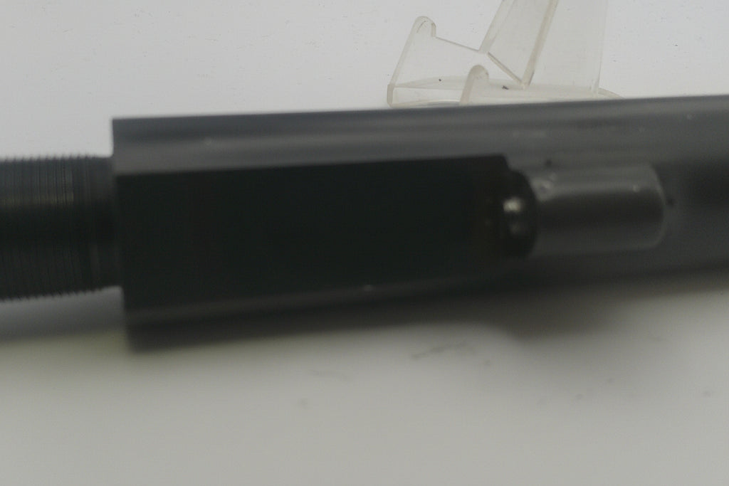 Close-up of a black metal object on a white background