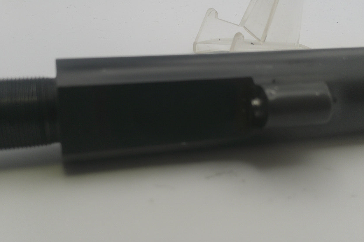 Close-up of a black metal object on a white background