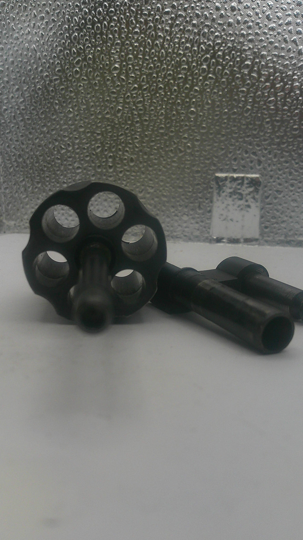 Black metal key on a textured surface