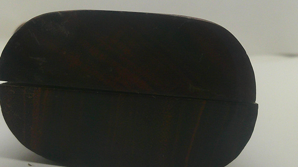A dark brown wooden oval box with a polished finish, shown closed on a plain light background.