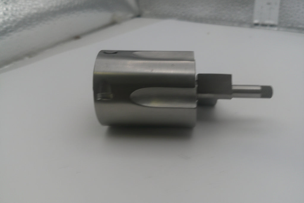 Metallic cylindrical object on a white surface
