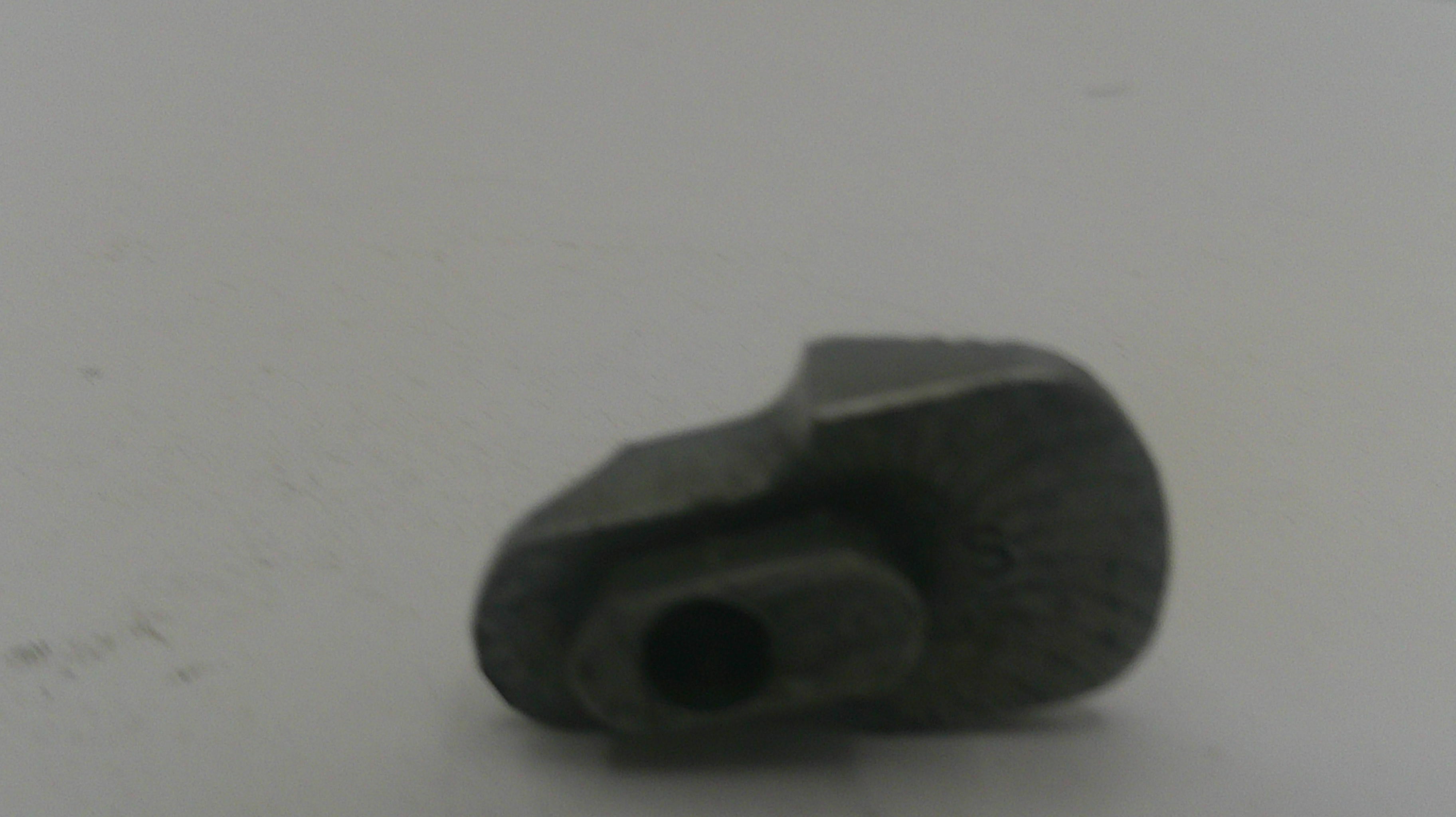 Black rubber grommet on a white background