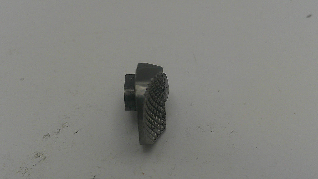 Metallic object on a light gray background