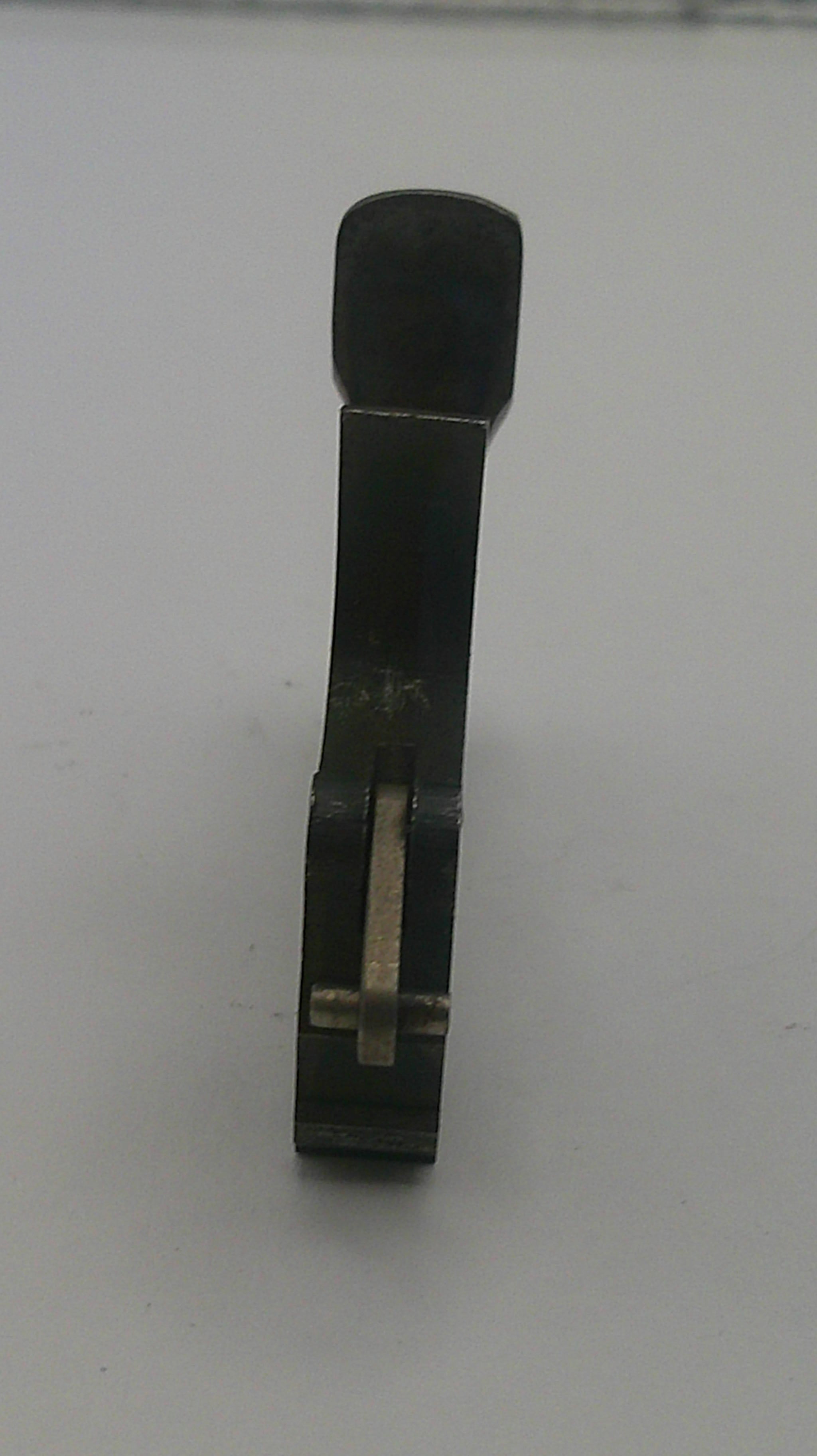 Black tie clip on a white background