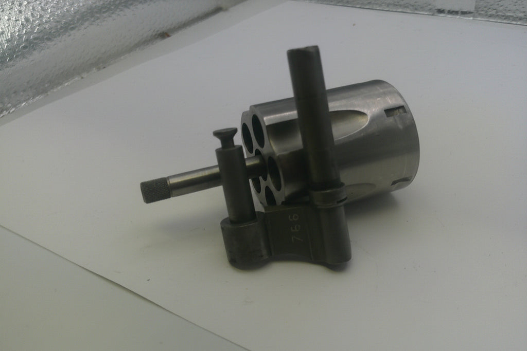 Metal mechanical component on a white surface