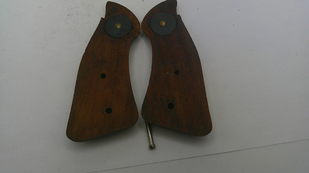Pair of brown gun grips on a white background