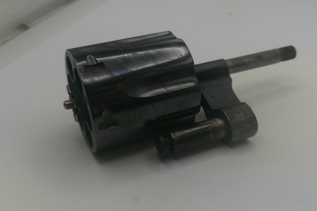 Black mechanical component on a white background